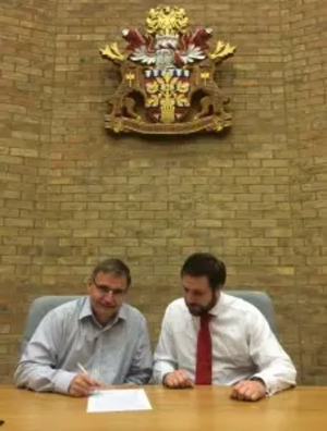 rg.uk/files/2016/05/Douglas-Pete-signing-agreement-227x300.jpg