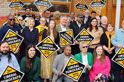 Clare Tevlin surrounded by other Liberal Democrat activists