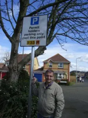 illor.org.uk/files/2016/04/Douglas-with-resident-parking-sign-The-Cannons-225x300.jpg