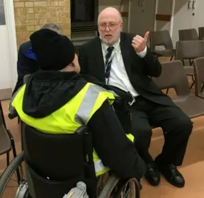 org.uk/files/2018/02/Paul-speaking-with-wheelchair-resident-Small-300x291.jpg