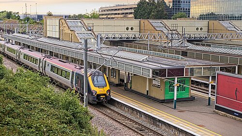 CMK railway station showing an arriving train