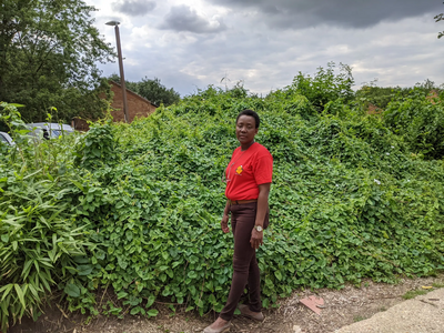 Nana by overgrown mound in Pennyland