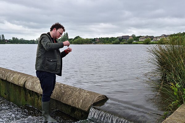 James Cox carrying out a water safety test at Furzton Lake
